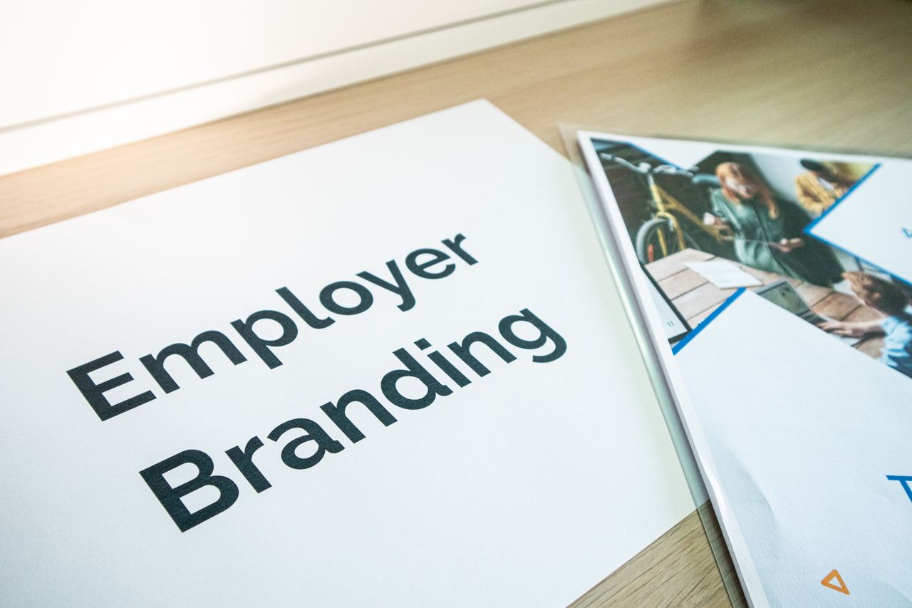 services-02 Focus on employer branding with documents on a wooden desk, ideal for business concepts.